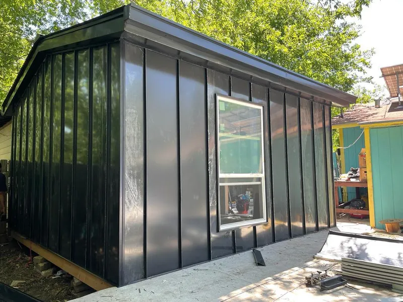 Black standing seam metal wall panels for Roof Inspection in Ridgeland